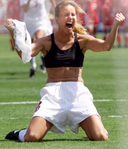 Brandi Chastain of the U.S. celebrates after kicking the scoring the penalty shot to win the 1999 Women's World Cup final against China July 10, 1999, at the Rose Bowl in Pasadena. The US won 5-4 on penalty kicks. (Credit: HECTOR MATA/AFP/Getty Images)