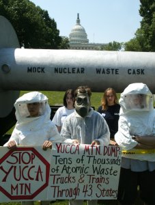 Protesters, dressed in protective clothing, stand in front of a mock nuclear waste cask, on Capitol Hill, June 18, 2002, in Washington, DC. (Credit: Mark Wilson/Getty Images)