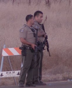 Police keep watch following a mass shooting at the Gilroy Garlic Festival in Santa Clara County on July 28, 2019. (Credit: AIO FILMZ)