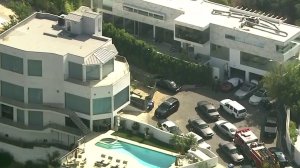 Rapper YG's Hollywood Hills home is seen being raided by sheriff's deputies on July 18, 2019. (Credit: KTLA)