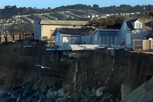 Remnants of a bluff-top apartment building in Pacifica that fell down to the beach are seen in an undated photo. (Credit: Carolyn Cole / Los Angeles Times)