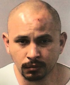 Isaac Manuel Orozco is seen in a booking photo released by the Kern County District Attorney's Office.