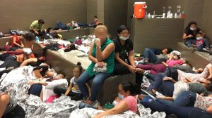 Families are crowded into the Border Patrol's Weslaco Station in Texas, this photo from the Office of Inspector General shows.