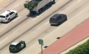 Officers are seen in pursuit of a driver on the northbound 405 in the West L.A. area on July 12, 2019. (Credit: KTLA)