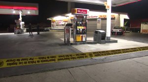 Police investigate a fatal shooting at a Shell gas station in North Hollywood on July 25, 2019. (Credit: KTLA)