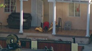 A barricaded suspect surrenders to law enforcement in South Los Angeles on July 2, 2019. (Credit: KTLA)