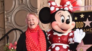 Voice actress Russi Taylor, who has voiced Minnie Mouse since 1986, poses with Minnie Mouse during a star ceremony in celebration of the 90th anniversary of Disney's Minnie Mouse at the Hollywood Walk of Fame on January 22, 2018 in Hollywood, California. (Credit: Alberto E. Rodriguez/Getty Images)