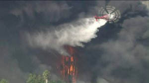 Fire crews drop water on a brush fire in the Sepulveda Basin area. (Credit: KTLA)