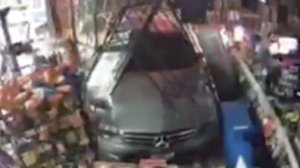 A burglar was caught on camera ramming a stolen car through the front of a Mission Viejo liquor store before fleeing with cash and lottery tickets on Aug. 3, 2019. (Credit: Orange County Sheriff's Department)