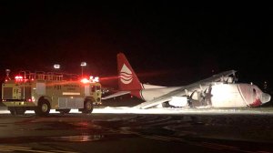 Seven people escaped unharmed after a C-130 airplane made an emergency landing and caught fire at Santa Barbara Airport on Aug. 25, 2019. (Credit: Santa Barbara County Fire Department)