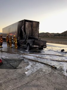 A a big rig and a pickup truck are seen in the middle of the northbound 5 Freeway in Castaic following a deadly crash on Aug. 14, 2019. (Credit: Caltrans District 7/Twitter)