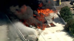 Firefighters battle a massive blaze at a commercial fire in Paramount on Aug. 19, 2019. (Credit: KTLA)