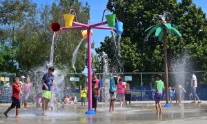 Children cool off at a water park in Alhambra on July 27, 2019. (Credit: FREDERIC J. BROWN/AFP/Getty Images)