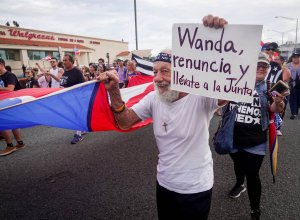 Protesters rally in the streets near the Department of Justice during an anti-government demonstration in San Juan, Puerto Rico, on July 29, 2019. (Credit: Angel Valentin / Getty Images)