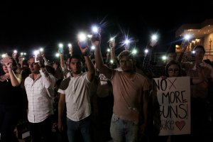 People hold their mobile phones with flash on during a vigil in Ciudad Juarez, Chihuahua state, in Mexico, on Aug. 3, 2019, after a mass shooting left 20 people dead in El Paso, Texas.(Credit: HERIKA MARTINEZ/AFP/Getty Images)