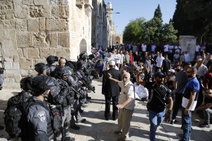 Palestinian Muslims face Israeli security forces as tensions rise inside the Al-Aqsa Mosque compound in the Old City of Jerusalem on August 11, 2019 (Credit: AHMAD GHARABLI/AFP/Getty Images)