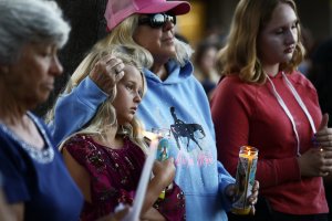 People attend a vigil in Gilroy for victims of the mass shooting at the garlic festival, July 29, 2019. (Credit: Mario Tama / Getty Images)