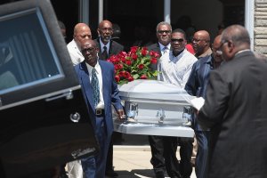 The remains of Derrick Fudge, 57, are placed in a hearse outside of St. John Missionary Baptist Church in Springfield, Ohio, following his funeral service on Aug. 10, 2019. Fudge was one of nine people killed when 24-year-old Connor Betts opened fire with a AR-15 style rifle in nearby Dayton.(Credit: Scott Olson / Getty Images)