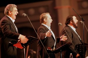 Placido Domingo, Jose Carreras and Luciano Pavarotti sing during the Three Tenors'' concert June 22, 2001 at Chamsil Olympic stadium in Seoul. (Credit: Chung Sung-Jun/Getty Images)