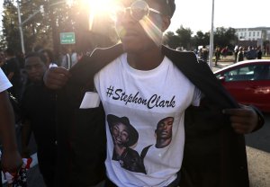 A Black Live Matter protester wears a shirt with a photo of Stephon Clark during a demonstration on March 22, 2018, in Sacramento, California. Hundreds of protesters staged a demonstration against the Sacramento police department after two officers shot and killed Stephon Clark, an unarmed black man, in the backyard of his grandmother's house following a foot pursuit. (Credit: Justin Sullivan/Getty Images)