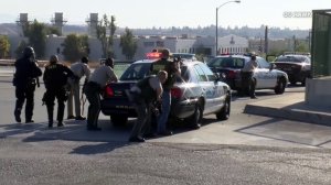 Officers respond to a shooting incident near at 215 Freeway overpass in the Riverside area on Aug. 12, 2019. (Credit: OC Hawk)