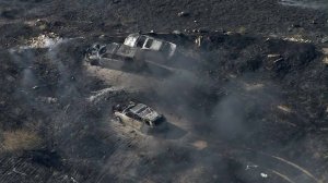 Three vehicles are burned at the site of a fire in Moreno Valley on Aug. 15, 2019. (Credit: KTLA)