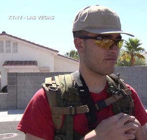 Conor Climo is seen patrolling his neighborhood with an assault rifle in a 2016 segment with KTNV. (Credit: KTNV via CNN)