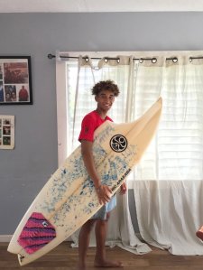 Max Keliikipi said a shark "bit a huge chunk off" his board. (Credit: Courtesy Max Keliikipi)