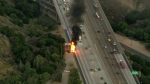 Flames engulfed a semitruck on the side of the northbound 5 Freeway in Santa Clarita on Aug. 14, 2019. (Credit: Sky5)