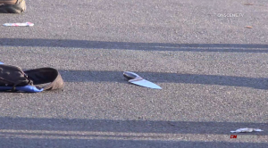 A knife is seen on the ground during the suspect's arrest in Santa Ana, after a crime rampage that killed four people in Orange County. 9Credit: (Onscene.TV)