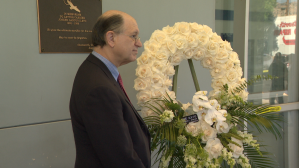 Congressman Brad Sherman is seen on Aug. 10, 2019, standing next to a plaque honoring Joseph Ilteto at a Chatsworth U.S. Postal office on the 20th anniversary of the shooting. (Credit: KTLA)