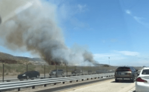 A fire burns along the 5 Freeway near Camp Pendleton on Aug. 17, 2019. (Credit: KTLA)