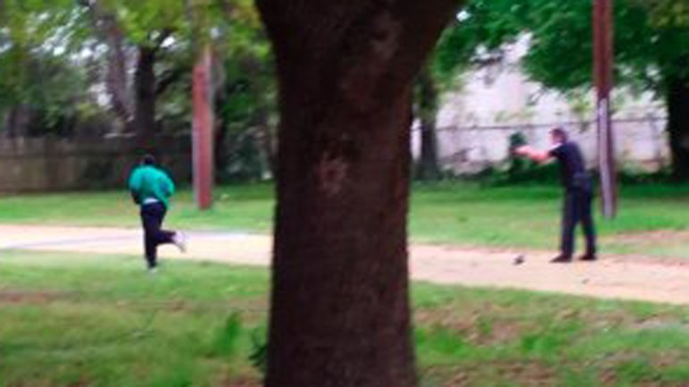 This still, released by the family of Walter Scott, shows North Charleston, South Carolina, police Officer Michael Slager shooting Scott in the back as he ran away from the officer on April 4, 2015.