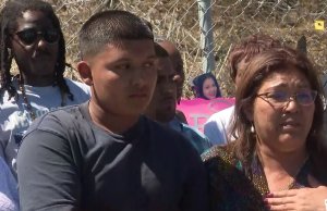 Keisha Saravia's son and mother, Keisha Saravia are seen during a news conference on Aug. 14, 2019. (Credit: KTLA)
