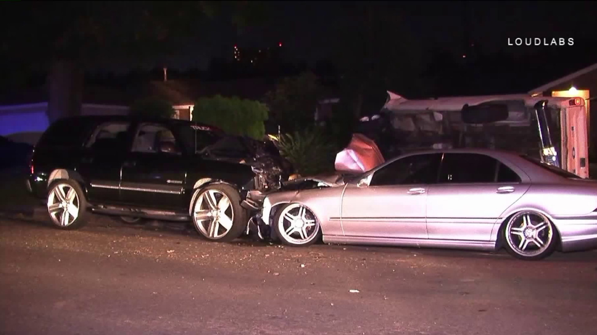 Neighbors say a man crashed an SUV into his wife's Mercedes-Benz in Valinda. (Credit: Loudlabs)