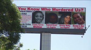 A digital billboard drawing attention to unsolved homicide cases was set up along the 605 Freeway in Baldwin Park on Aug. 24, 2019. (Credit: KTLA)