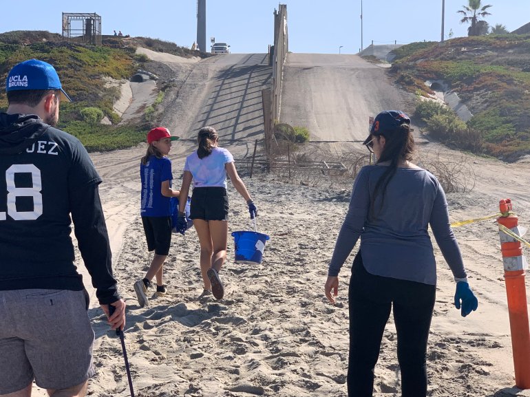 Volunteers picking up trash on Saturday, Sept. 21, 2019, at Imperial Beach, California got too close to an enforcement zone near the border wall. (Border Report Photo/Sandra Sanchez).