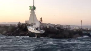 Deputies rescued 3 men after their sailboat crashed on rocks in Marine del Rey on Sept. 7, 2019. (Credit: Los Angeles County Sheriff's Department)