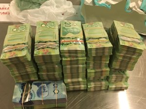 Stacks of cash seized as part of federal probe into drug trafficking from Mexico to SoCal is seen in this photo released by the U.S. Department of Justice on Sept. 5, 2019. 