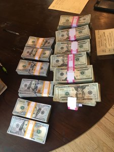 Detectives seized more than $100,000 in cash while carrying out raids targeting a suspected drug dealer in Porter Ranch and Chatsworth on Sept. 26, 2019. (Credit: Ventura County Sheriff's Department)