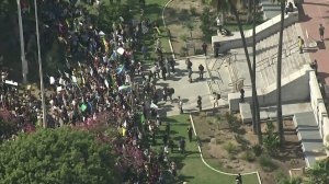 Demonstrators stand in front of Los Angeles City Hall for one of a series of worldwide demonstrations on climate change held on Sept. 20, 2019. (Credit: KTLA)