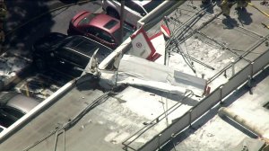 A plane crashed on the roof of a business in Torrance on Sept. 19, 2019. (Credit: KTLA)