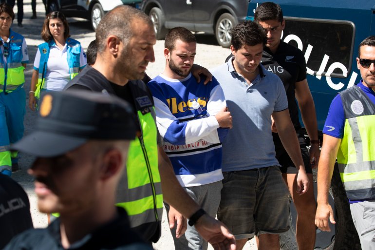David Fresneda, center, son of Spanish winter Olympic medallist Blanca Fernandez Ochoa, is comforted as he walks along the search coordination center in Las Dehesas, Spain, on Sept. 4, 2019. (Credit: Pablo Blazquez Dominguez / Getty Images)