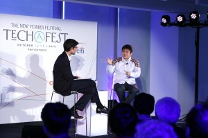 Journalist Nicholas Thompson, left, speaks to then director of the MIT Media Lab Joi Ito on stage during The New Yorker Festival at One World Trade Center on Oct. 3, 2015 in New York City. (Credit: Anna Webber/Getty Images for The New Yorker)