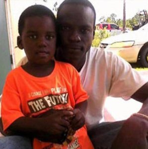 Adrian Farrington and his son, Adrian Jr. are seen in a family photo provided by CNN.