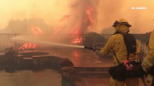 Crews defend a home from the Tenaja Fire on Sept. 5, 2019. (Credit: OC Hawk)