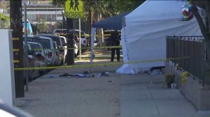 Authorities investigate after three people were shot in Wilmington on Sept. 18, 2019. (Credit: KTLA)