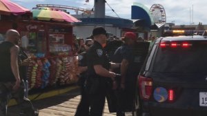 Officers responding to a pepper spray incident at Santa Monica Pier take a man into custody on Oct. 20, 2019. (Credit: KTLA)