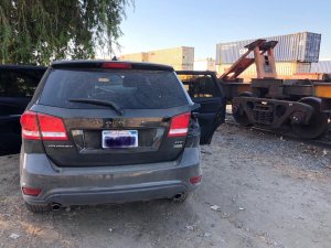 A Dodge Journey used by three burglary suspects crashed at a train track in Fullerton after a police pursuit on Oct. 22, 2019. (Credit: Fullerton police)