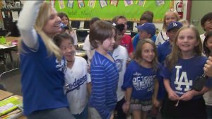 Holly Lang, far left, and her students, root on the Dodgers from their classroom on Oct. 3, 2019. (Credit: KTLA)